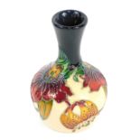 A Moorcroft Pottery vase decorated in the Anna Lily pattern, painted and impressed marks, 10cm high.