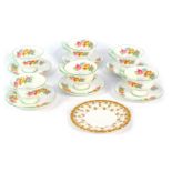 A set of six Shelley cups and saucers, each with a floral pattern and green border, and a Spode side