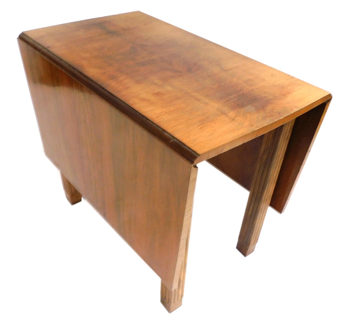 A mid century walnut drop leaf table, with quarter veneered top, on reeded column legs, 76cm high, 9