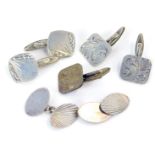 A group of silver cuff links, comprising two pairs of silver floral engraved cuff links, a pair of o