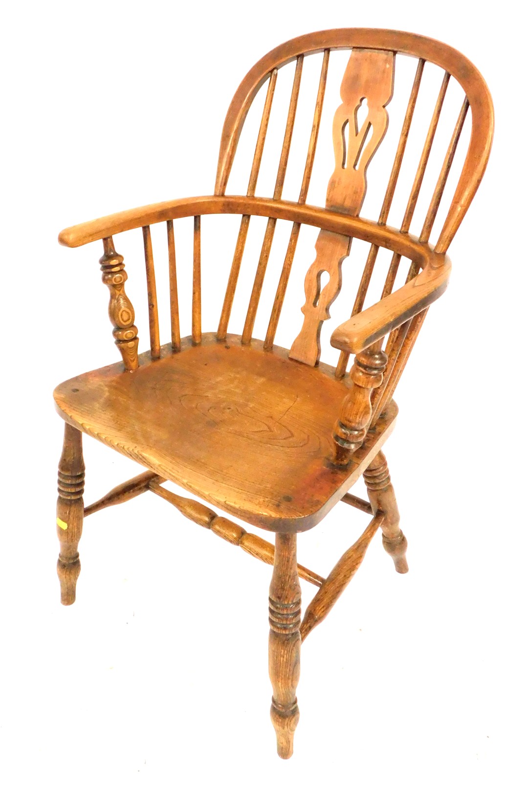 A 19thC beech oak and elm Windsor chair, with a pierced splat back, solid saddle seat raised on turn