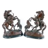 A pair of late 19thC patinated spelter figures of Marley horses, raised on a naturalistic ground and