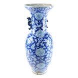 A 19thC Qing Dynasty blue and white porcelain vase, with dragon handles, decorated with flowers and