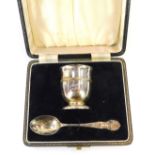 A George VI silver child's egg cup and spoon, with a moulded border inscribed Ann 12-11-39, with a s