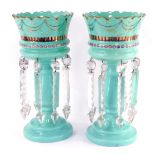 A pair of late 19thC Continental turquoise glass lustres, with gilt and enamelled floral decoration,