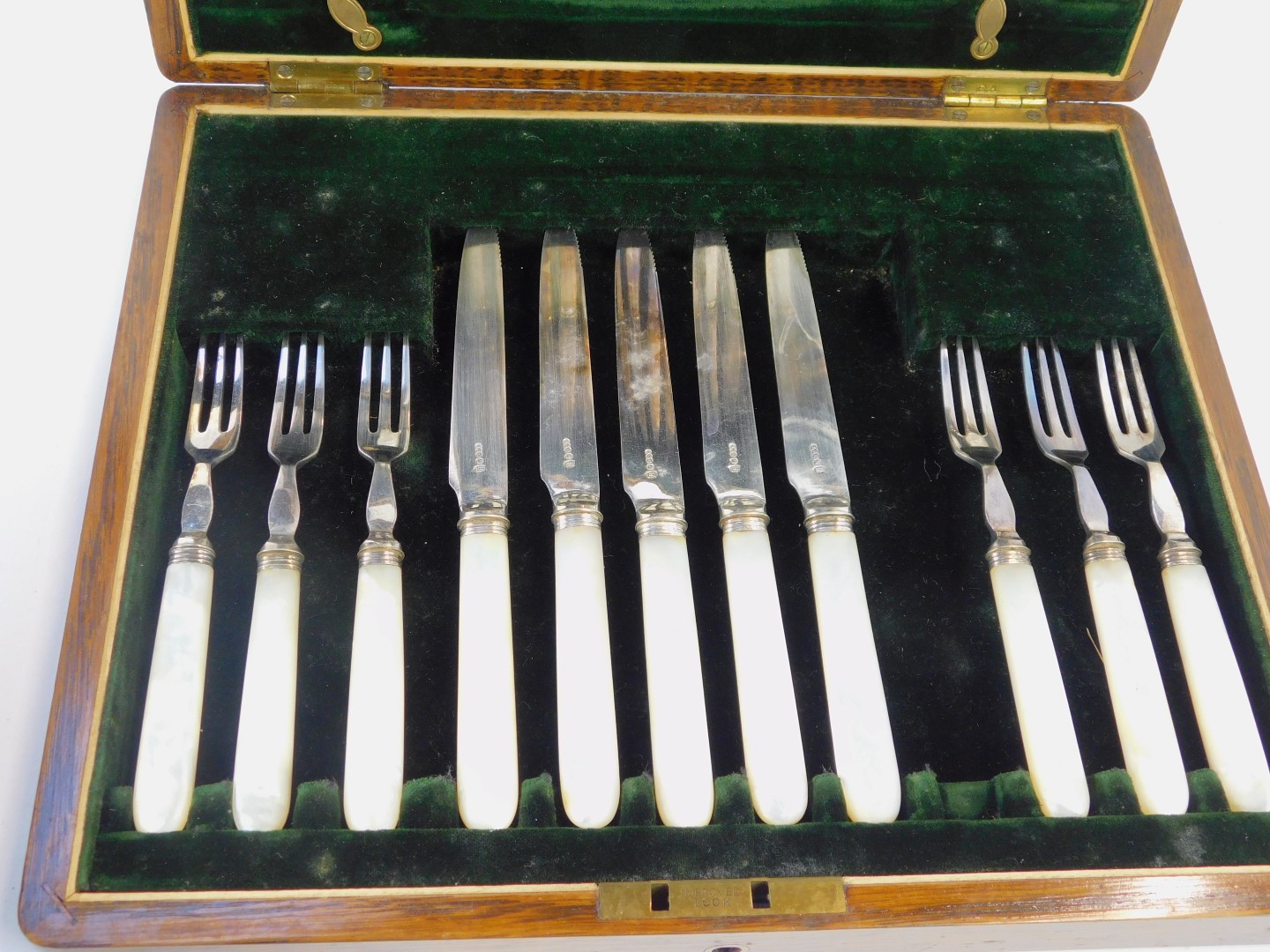 A part canteen of mother of pearl and stainless steel bladed fruit knives and forks, in a fitted oak - Image 2 of 2