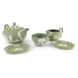 A Wedgwood green Jasperware three piece tea set, sprigged with classical figures, comprising teapot,
