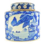 A late 20thC Chinese blue and white canister and cover, of oval form, decorated with reserves of fig