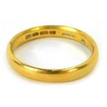 A 22ct gold wedding band, of plain design, Birmingham 1923, ring size R½, 6g.