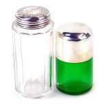 Two silver dressing table jars, comprising a green glass smelling salts jar, with silver lid, and a