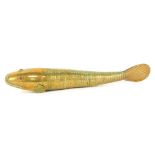 An articulated brass Medina style fish, with cabochon red set eyes, 26cm long.