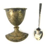 A George V silver coffee spoon, Birmingham 1931, together with a silver plated egg cup. (2, AF).