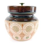 A late 19thC stoneware two tone tobacco jar, decorated with floral motifs, patent number 8087, impre