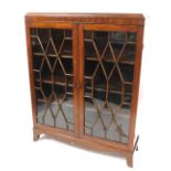 An Edwardian mahogany display cabinet, with two astragal glazed doors, and a fitted three shelf inte