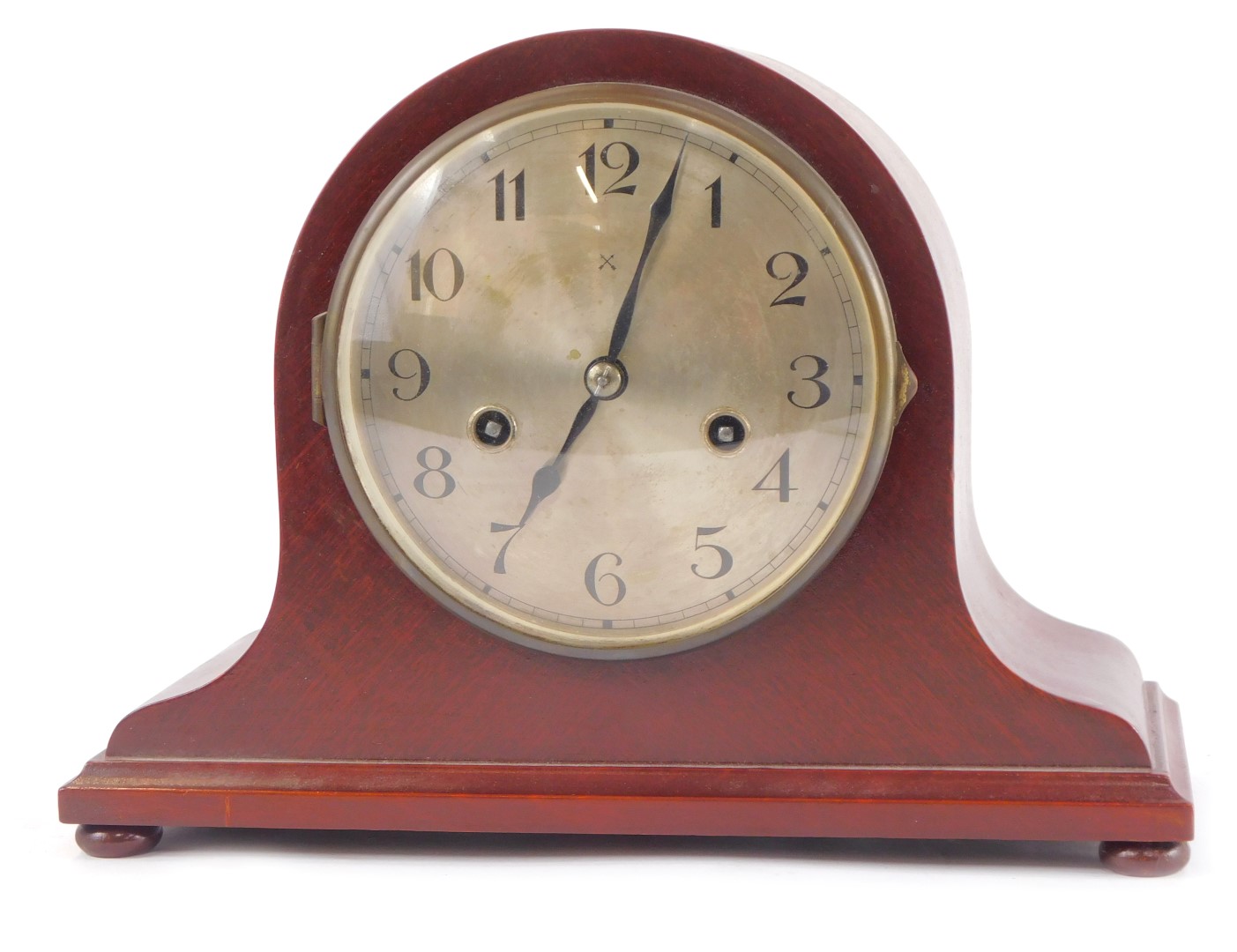 An early 20thC Hamburg American Clock Company mahogany cased mantel clock, circular silver dial bear