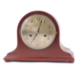 An early 20thC Hamburg American Clock Company mahogany cased mantel clock, circular silver dial bear