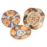 Three Chinese Imari dishes, variously decorated.