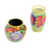 A Moorcroft Pottery miniature enamel vase decorated in the Pomegranate pattern, 6cm high,