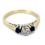 A sapphire and diamond three stone dress ring, the central illusion set diamond, in four claw settin