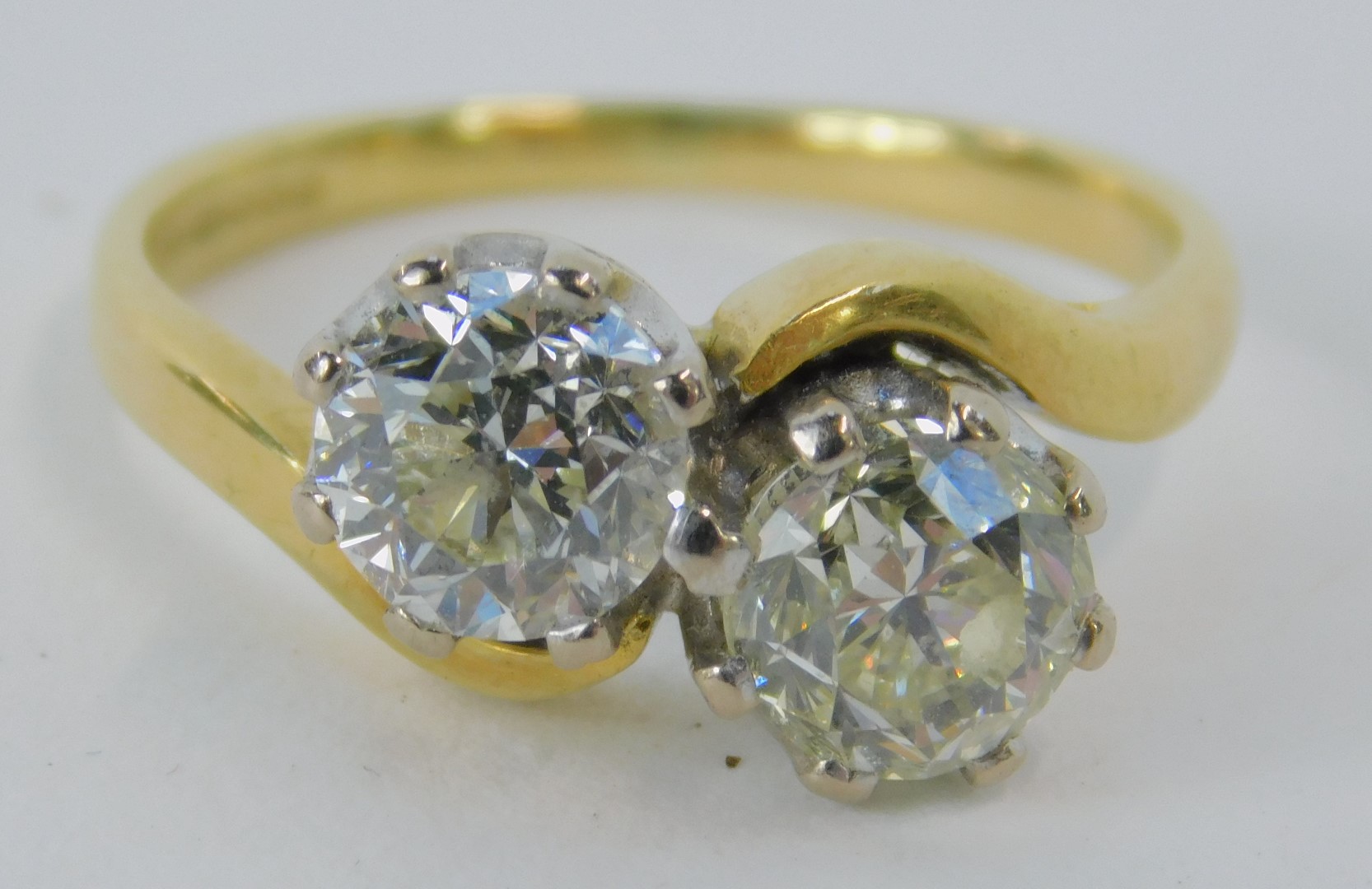 An 18ct gold diamond two stone twist ring, set with two bold cut diamonds, each stone approx 0.87ct, - Image 2 of 3