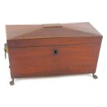 A late Regency mahogany sarcophagus form tea caddy, with brass lion's head and ring handles, the hin