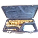 A Yamaha brass saxophone, Yas-275, number 257424, cased, together with stands, music books and clean