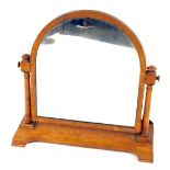 A Victorian burr walnut dressing table mirror, the arched top with walnut inlay, on shaped foot, 70c