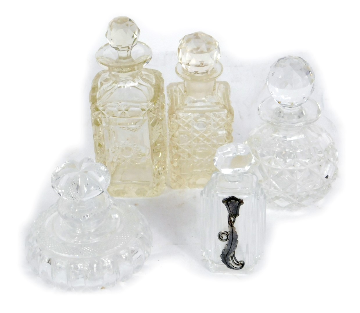 Five Victorian and later cut glass scent bottles, to include one of squat form, four rectangular, ea