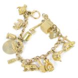 A 9ct gold charm bracelet, on curb link chain with various charms, to include box, key, beaver, tige