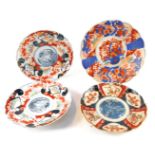 Four Chinese Imari plates, variously decorated.