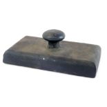 A Victorian cast iron desk paperweight, of rectangular form, 15cm wide.