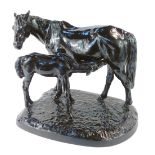 A Soviet mid century cast iron sculpture of a horse and foal, black painted, modelled standing with