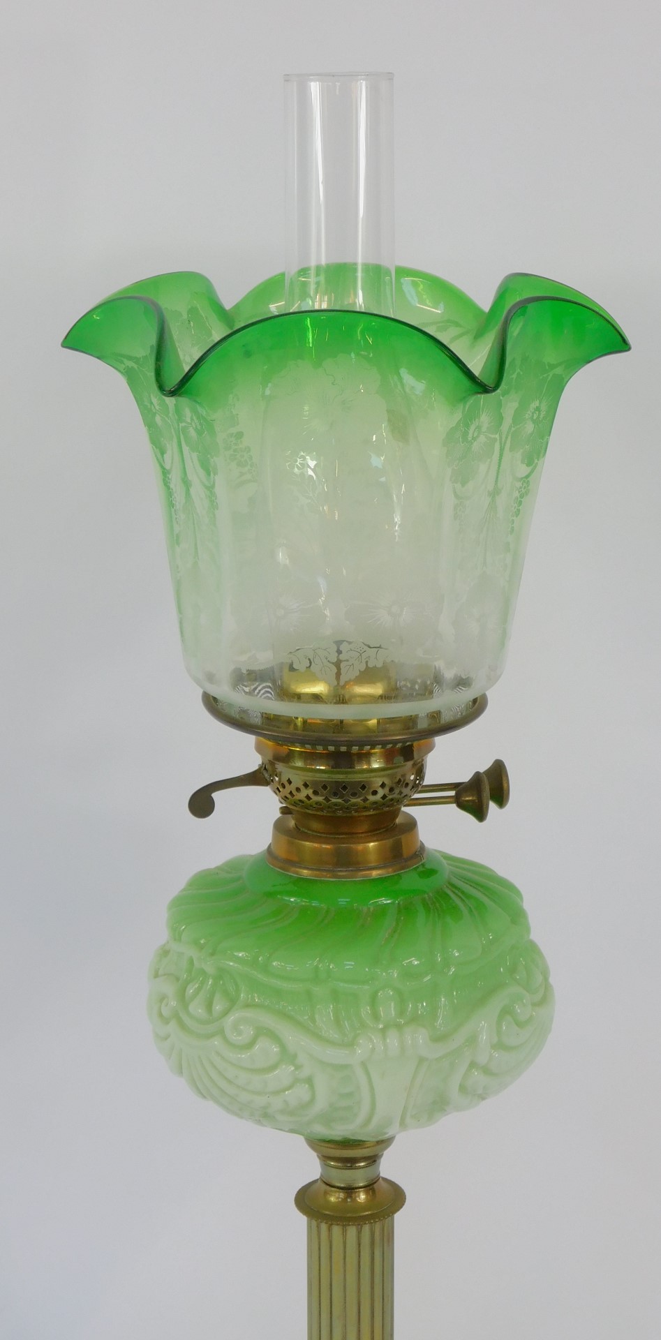 A 19thC brass and green opaline glass oil lamp, on a black socle base, with stepped brass foot on a - Image 2 of 3