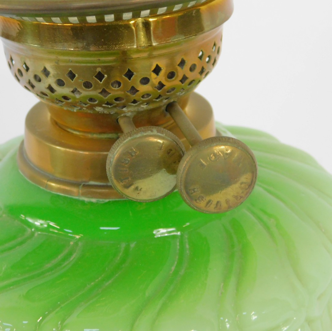 A 19thC brass and green opaline glass oil lamp, on a black socle base, with stepped brass foot on a - Image 3 of 3