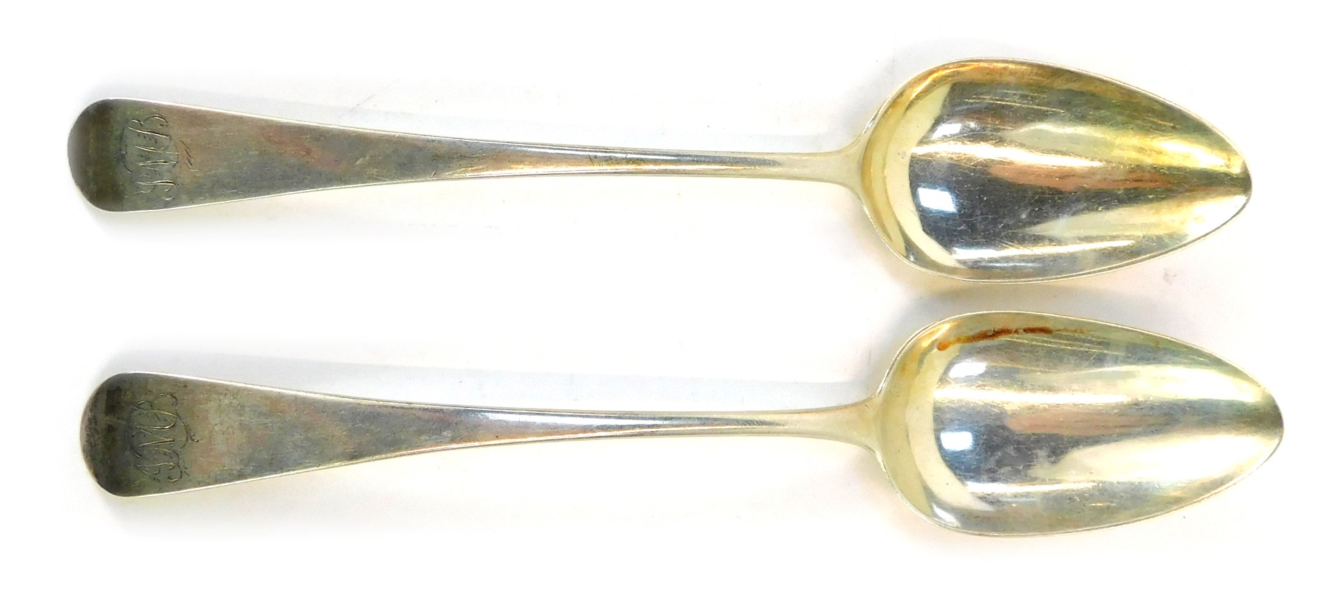 Two George III silver Old English pattern serving spoons, each bearing the initial J M B, London 179