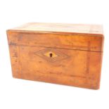 A Victorian walnut and satinwood banded tea caddy, of rectangular section, the hinged lid opening to
