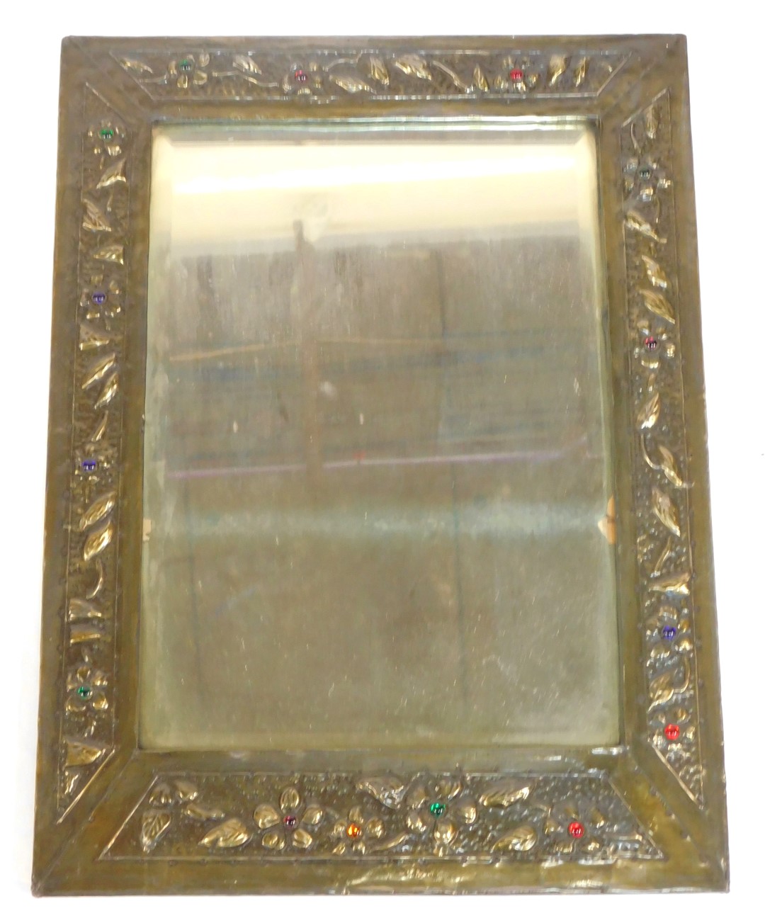 An early 20thC Arts & Crafts brass rectangular framed wall mirror, inset bevelled glass, the surroun