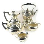 A Walker and Hall four piece silver plated semi fluted tea set, each with ebonised knops, and a Walk