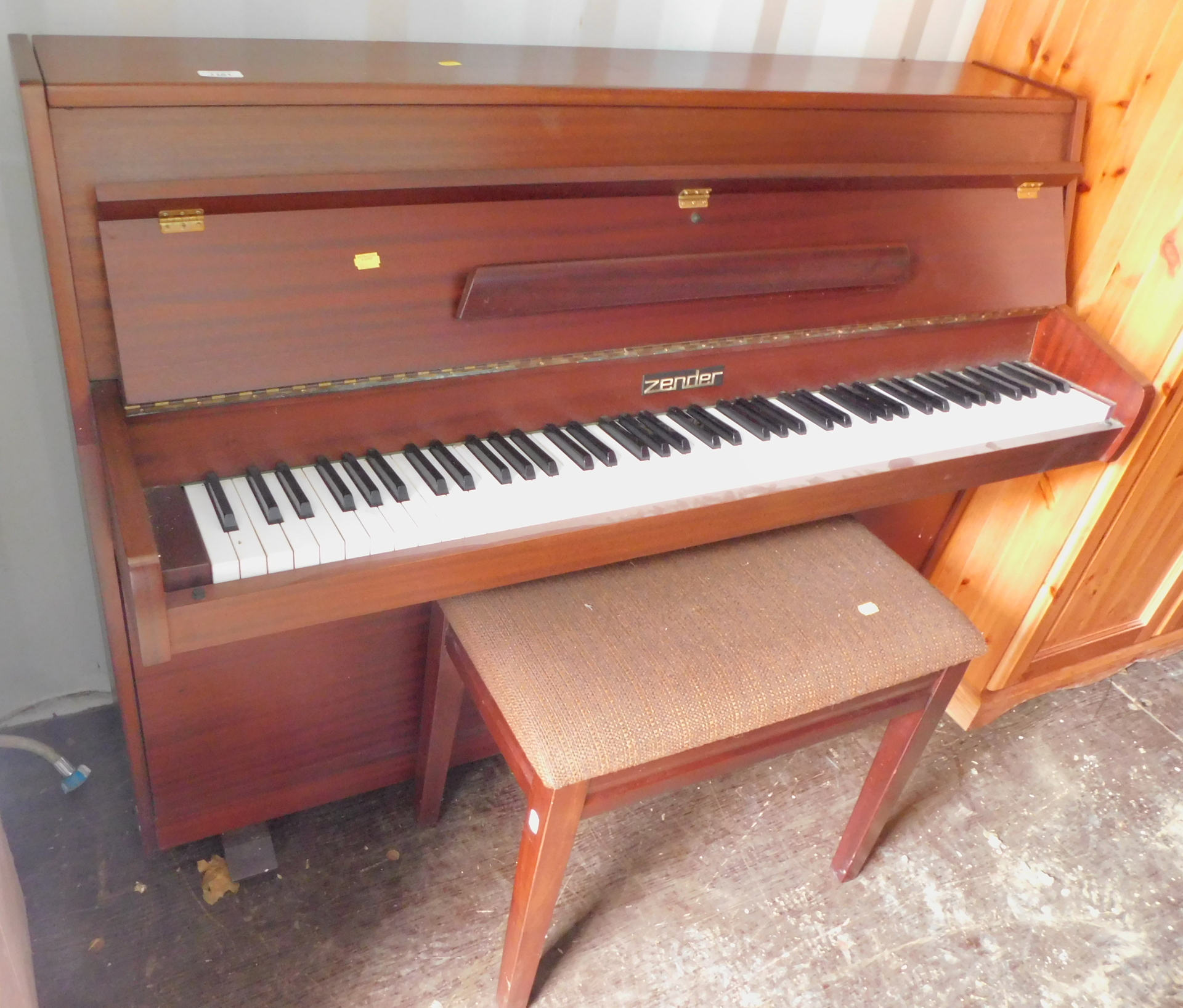 A Zender upright piano, and a piano stool. (2)