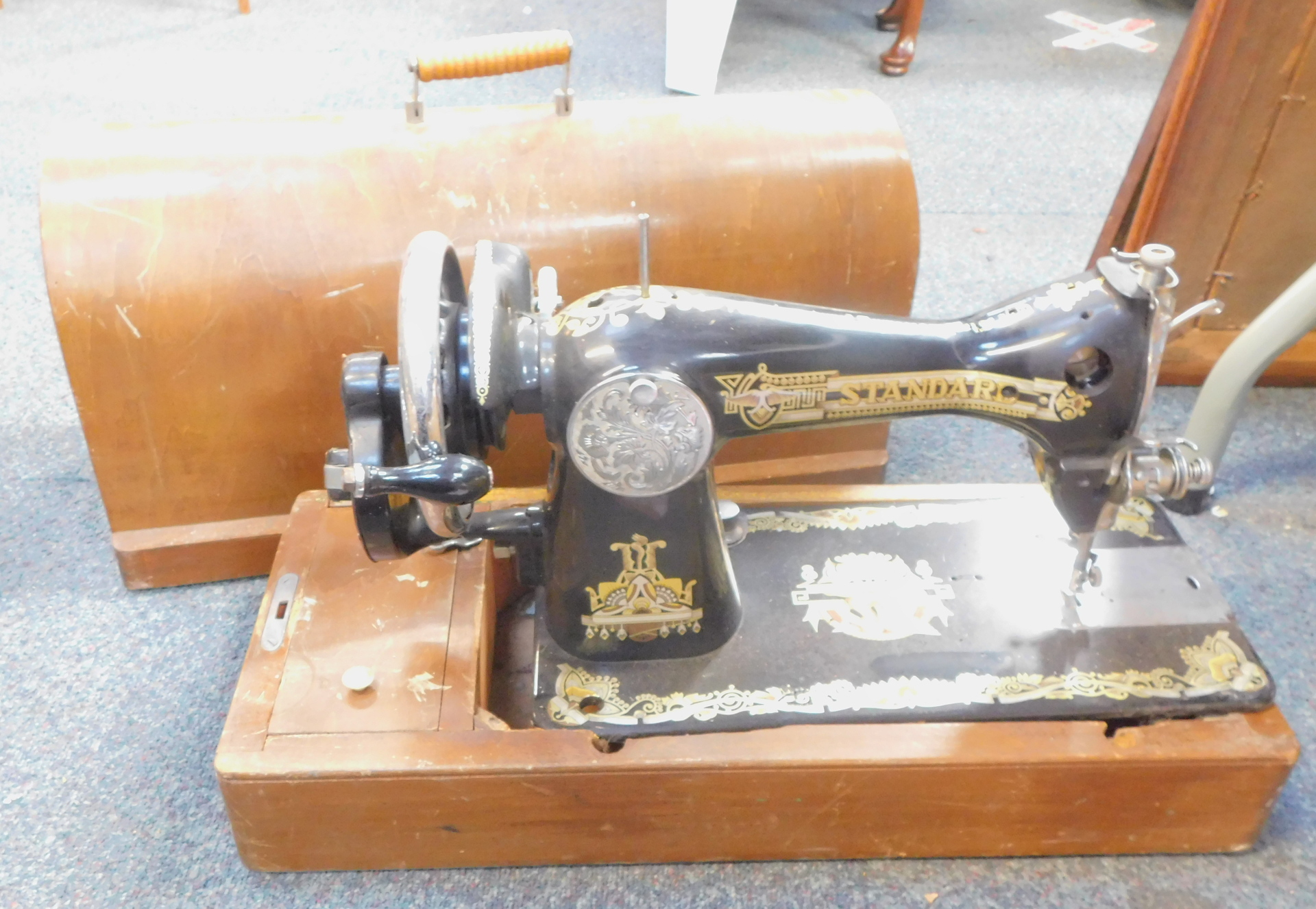 A cased Singer sewing machine.