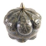 An Eastern metal jar, of crown shape, with plain interior, unmarked, 9cm high.