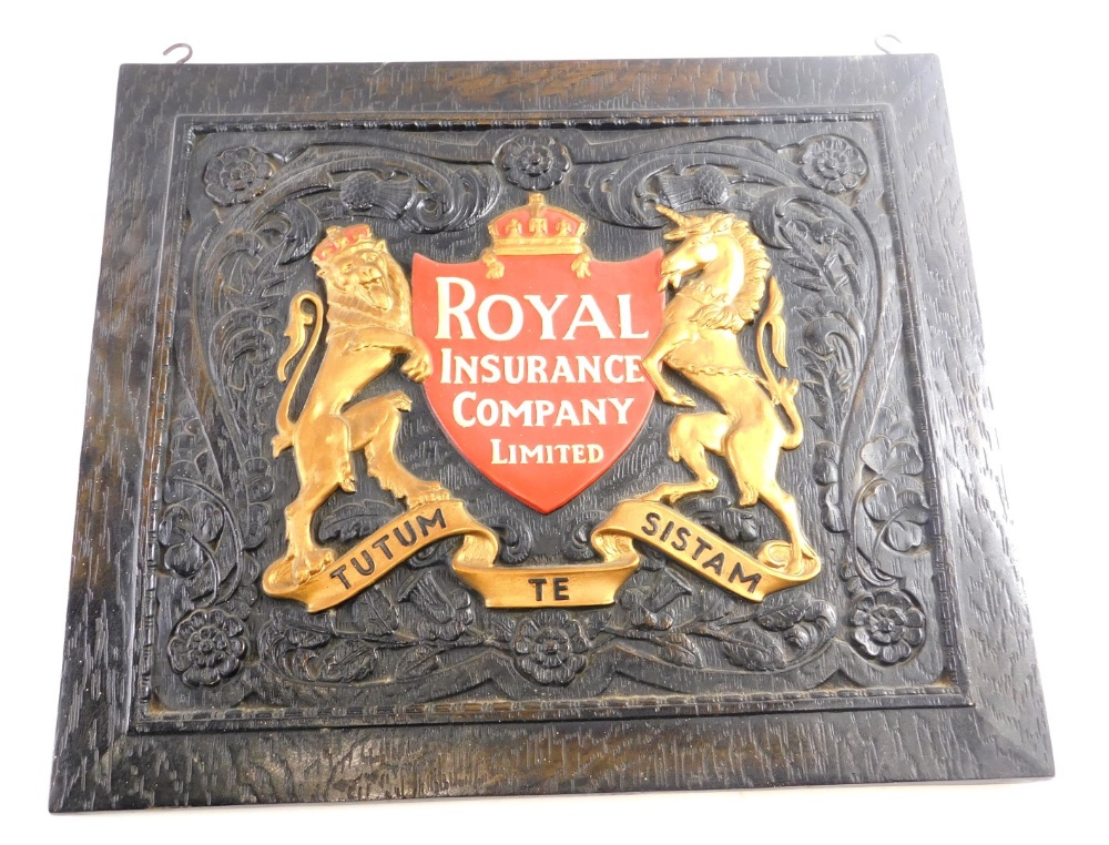 A mid 20thC oak backed Royal Insurance Company Ltd sign, with hooks to the top, raised with gilt Lio