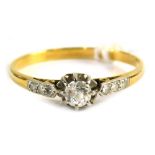 An 18ct gold diamond solitaire ring, set with central old cut diamond approx 0.15ct, in a platinum c
