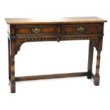 An oak small dresser or side table, in 18thC style, the rectangular top above two frieze drawers and