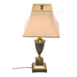 A table lamp, with urn stem, on stepped square base terminating in bracket feet, with modern shade a