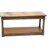 An oak magazine rack, in the manner of Titchmarsh and Goodwin, with rectangular table top, 49cm wide