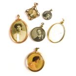 Various Edwardian and other photograph lockets, one oval, with a glazed front and back, 7cm high, an