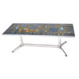 A 1960s/70s polished metal coffee table, the rectangular top inset with a psychedelic abstract in co
