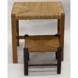 An early 20thC stool, with rope top, on turned legs joined by cylindrical stretchers, 25cm high, and