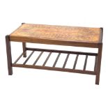 A 1970s G-Plan style teak coffee table, with a pattern tile top and a slatted undertier, 87cm wide.